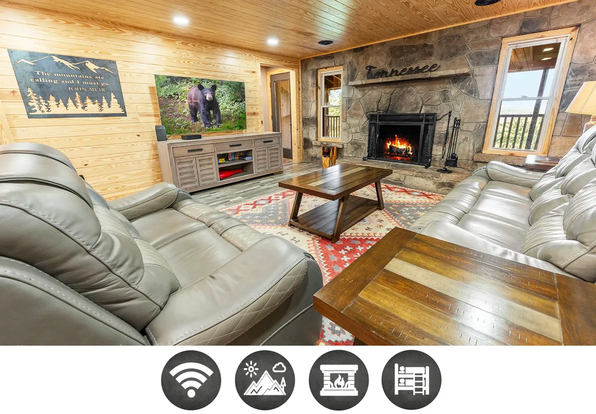 The image showcases a cozy living area with a glowing fireplace, a TV displaying a serene nature scene, and inviting wooden cabin decor. The space is accented by a patterned rug and comfortable seating, creating a perfect spot for families or groups to gather and unwind after a day in the Smoky Mountains.